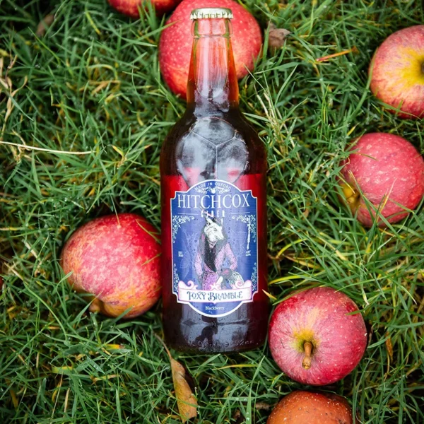 Hitchcox Foxy Brambles Cider surrounded by apples