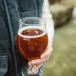 Hitchcox glass of cider being held